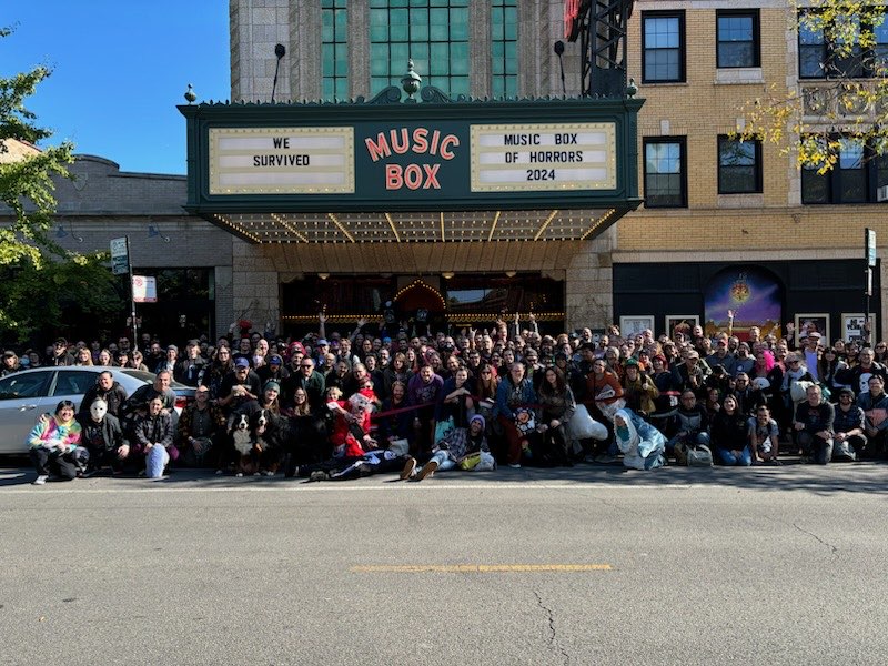Image of a group of 700 people standing in front of the Music Box Theater in Chicago, post Music Box of Horrors 2024